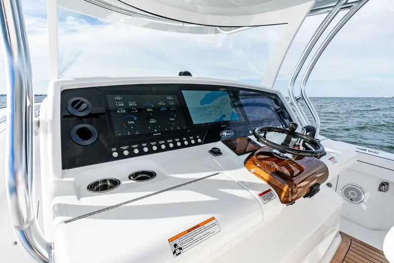 Slide: The Image of 2025 Valhalla Boatworks V-46 helm with advanced navigation displays and steering wheel. - 15