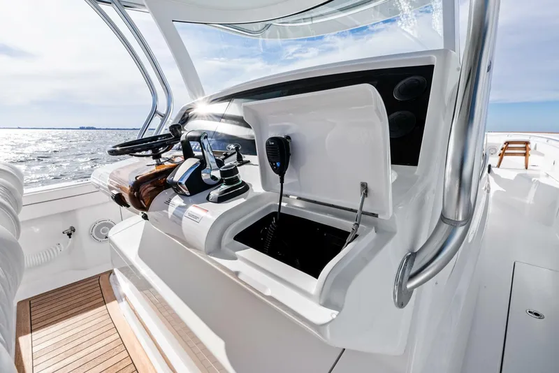 Slide: The Image of 2025 Valhalla Boatworks V-46 helm with modern controls and ocean view. - 19