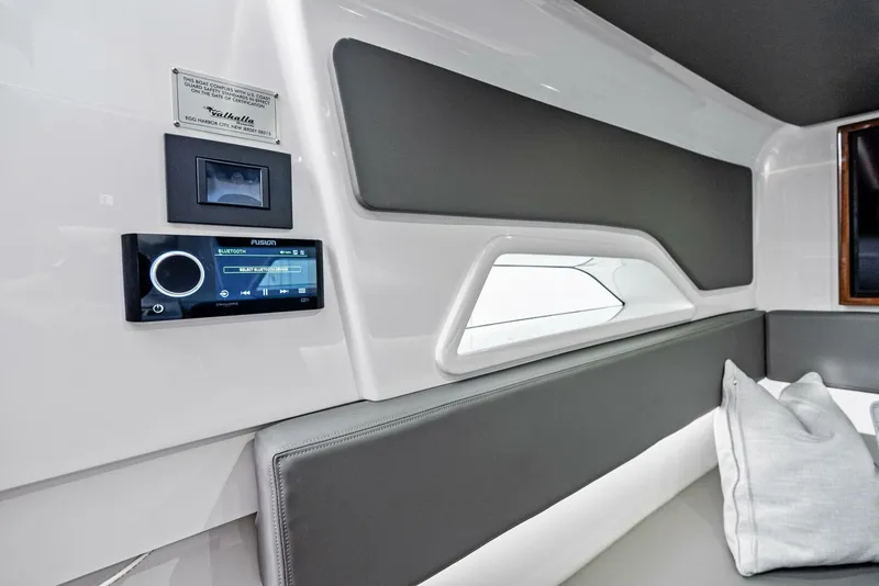 Slide: The Image of Interior of 2025 Valhalla Boatworks V-46, featuring modern design and advanced audio system. - 25