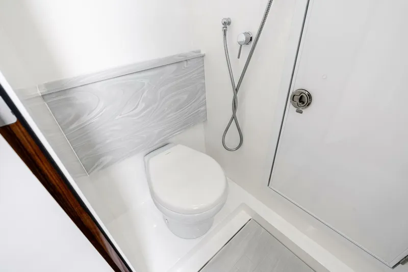 Slide: The Image of Modern bathroom in 2025 Valhalla Boatworks V-46 yacht, featuring sleek design and fixtures. - 28