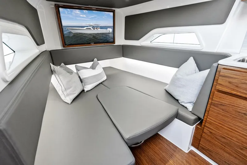 Slide: The Image of Interior of 2025 Valhalla Boatworks V-46 with modern seating and ocean view. - 30