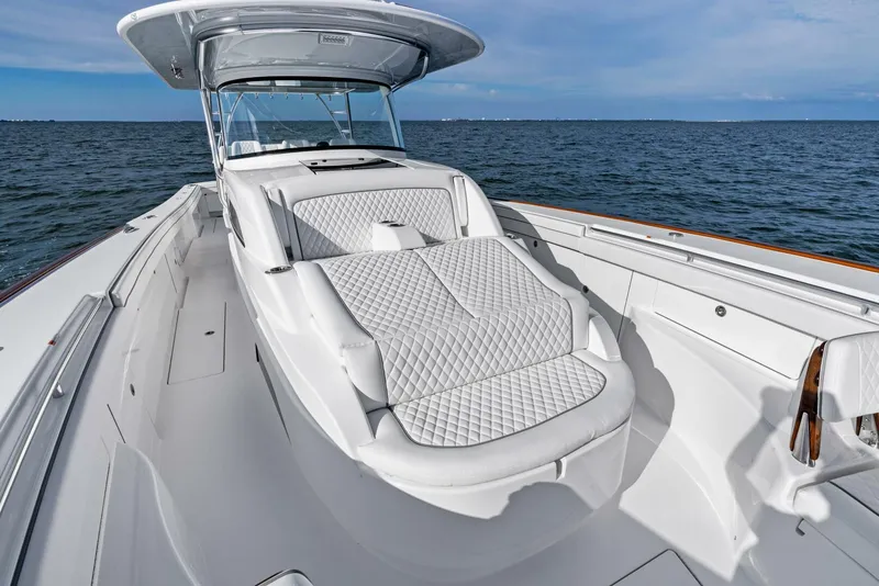 Slide: The Image of 2025 Valhalla Boatworks V-46 luxury boat with spacious deck and cushioned seating. - 35