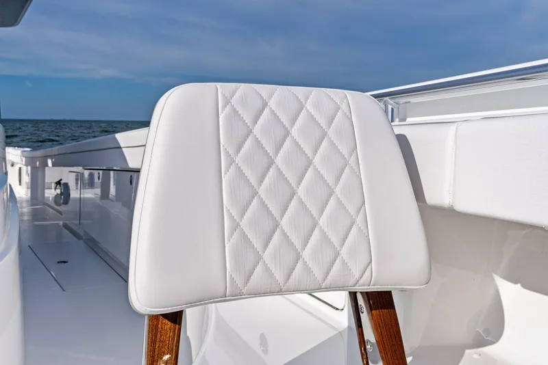 Slide: The Image of 2025 Valhalla Boatworks V-46, featuring elegant white seating with diamond stitching. - 36