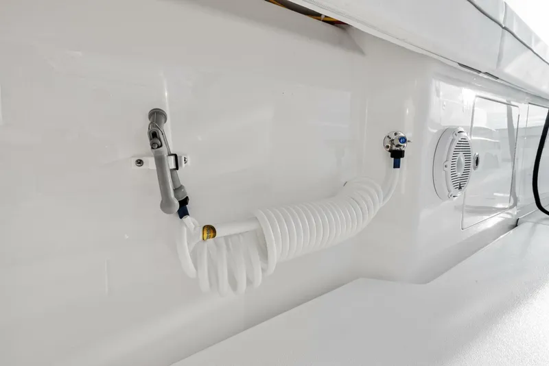 Slide: The Image of 2025 Valhalla Boatworks V-46 deck detail with coiled hose and speaker. - 39
