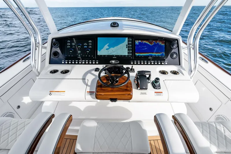 Slide: The Image of 2025 Valhalla Boatworks V-46 helm with advanced navigation displays and luxurious seating. - 4