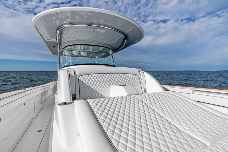 Slide: The Image of 2025 Valhalla Boatworks V-46 with luxurious seating on open water. - 43