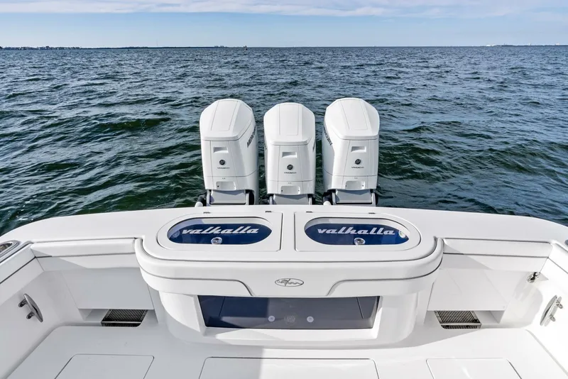 Slide: The Image of 2025 Valhalla Boatworks V-46 with triple engines on open water. - 47