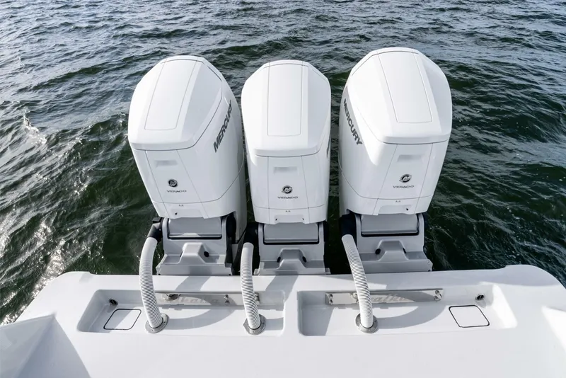 Slide: The Image of 2025 Valhalla Boatworks V-46 with triple Mercury outboard engines on water. - 49