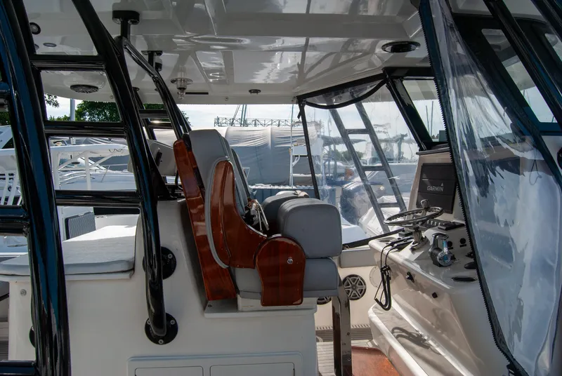 Slide: The Image of Interior view of 2014 Insetta i45C boat cockpit with helm and seating. - 12