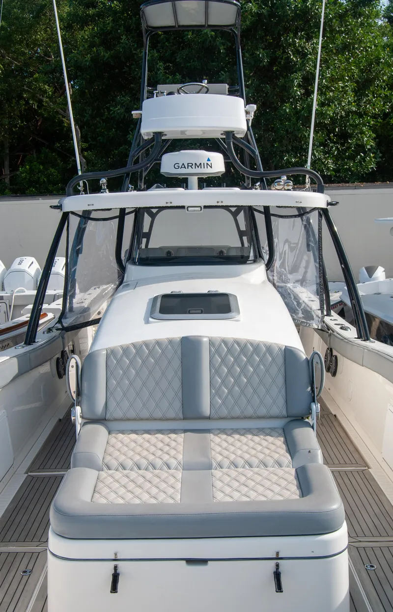 Slide: The Image of 2014 Insetta i45C boat with cushioned seating and Garmin equipment. - 16