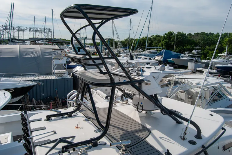 Slide: The Image of Insetta i45C 2014 boat with tower, docked among other vessels in a marina. - 8