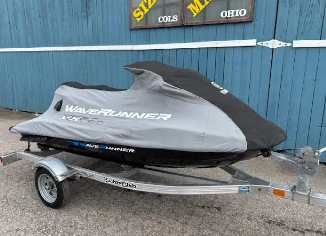 Slide: The Image of 2019 Yamaha WaveRunner VX Cruiser on trailer, covered, parked by blue building. - 12