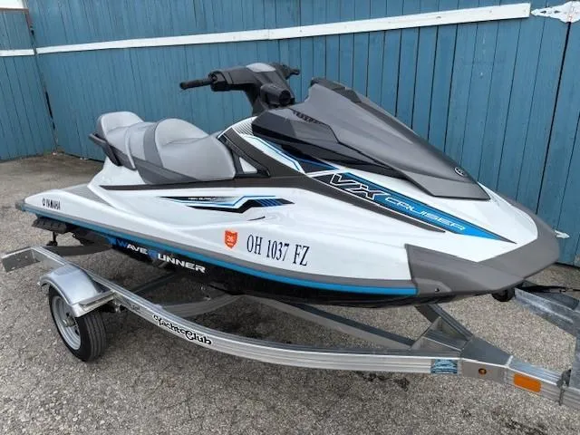 Slide: The Image of 2019 Yamaha WaveRunner VX Cruiser on trailer, parked by blue wall. - 2
