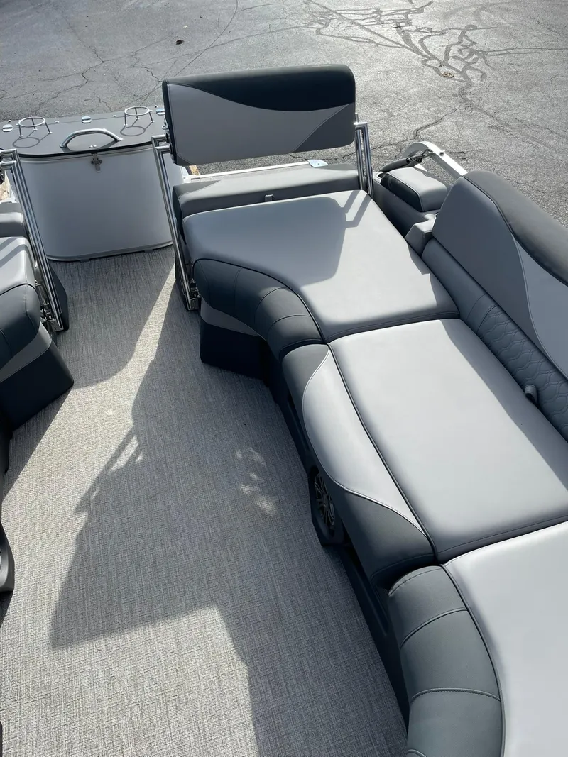 Slide: The Image of 2025 Avalon LSZ Quad Lounger Shift with sleek gray seating on a boat deck. - 16
