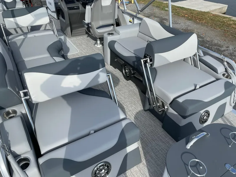 Slide: The Image of 2025 Avalon LSZ Quad Lounger Shift boat with luxurious gray seating and modern design. - 18