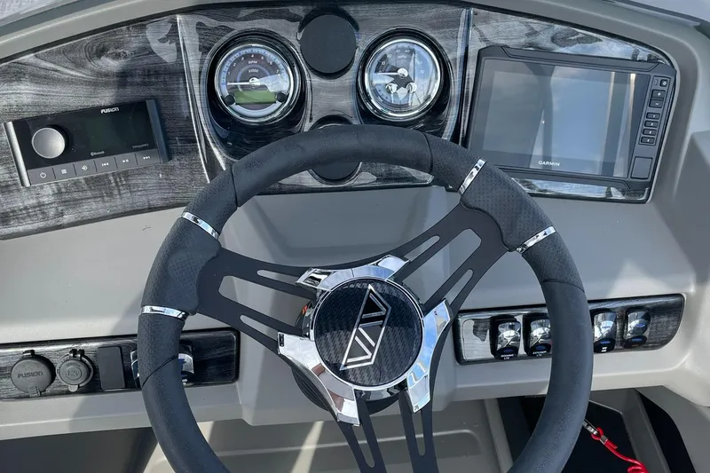 Slide: The Image of 2025 Avalon LSZ Quad Lounger Shift dashboard with steering wheel and control panel. - 21