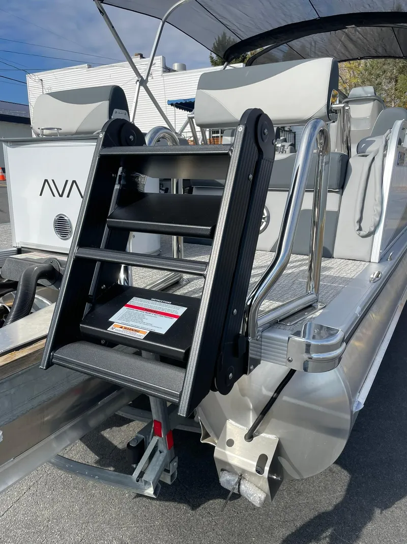 Slide: The Image of Avalon LSZ Quad Lounger Shift 2025 pontoon boat with rear boarding ladder. - 5