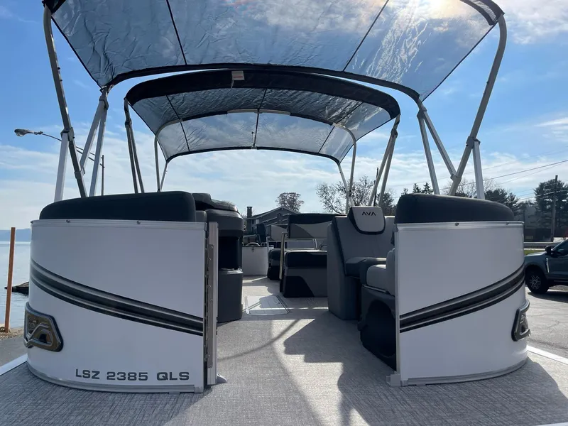 Slide: The Image of 2025 Avalon LSZ Quad Lounger Shift pontoon boat with canopy, spacious seating, and modern design. - 8