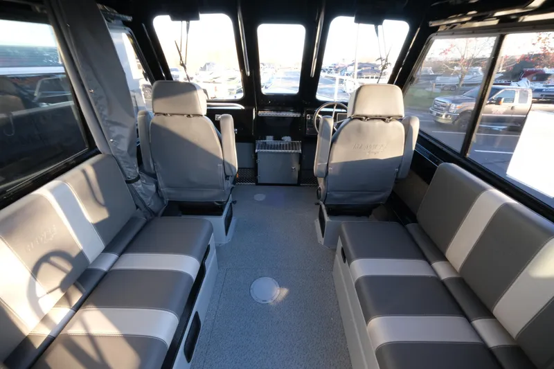 Slide: The Image of Interior of 2025 Hewescraft 220 Ocean Pro ET HT boat with seating and steering wheel. - 11