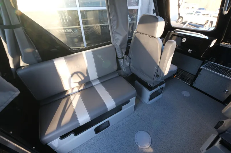 Slide: The Image of Interior of 2025 Hewescraft 220 Ocean Pro ET HT boat, featuring seating and storage. - 13