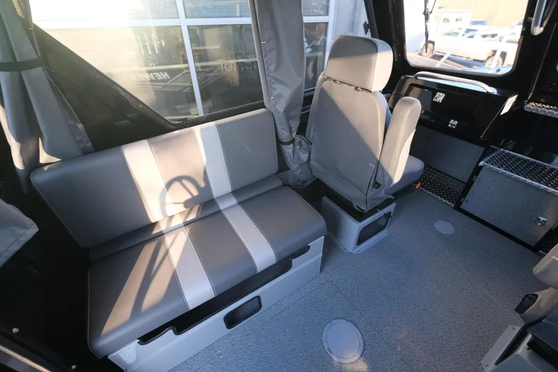 Slide: The Image of Interior of 2025 Hewescraft 220 Ocean Pro ET HT boat with seating and storage. - 14