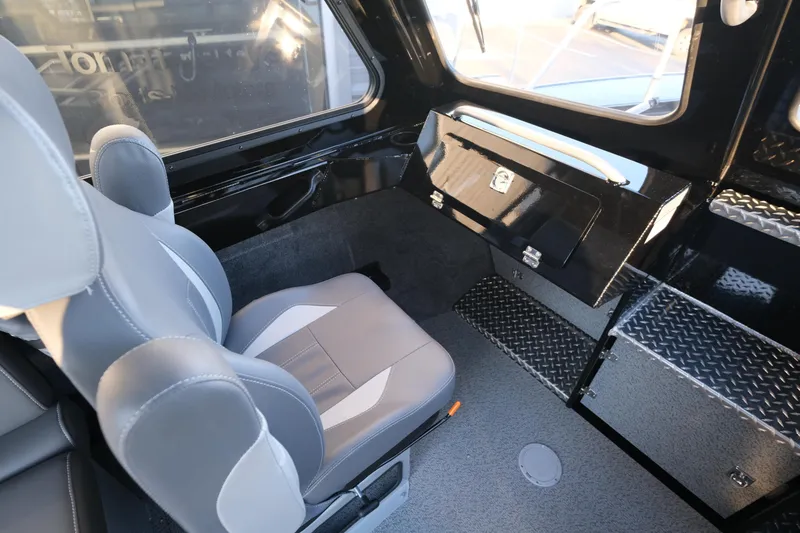 Slide: The Image of Interior of 2025 Hewescraft 220 Ocean Pro ET HT, featuring seating and storage. - 17