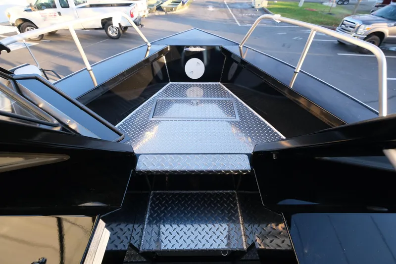 Slide: The Image of 2025 Hewescraft 220 Ocean Pro ET HT boat deck with diamond plate flooring. - 18