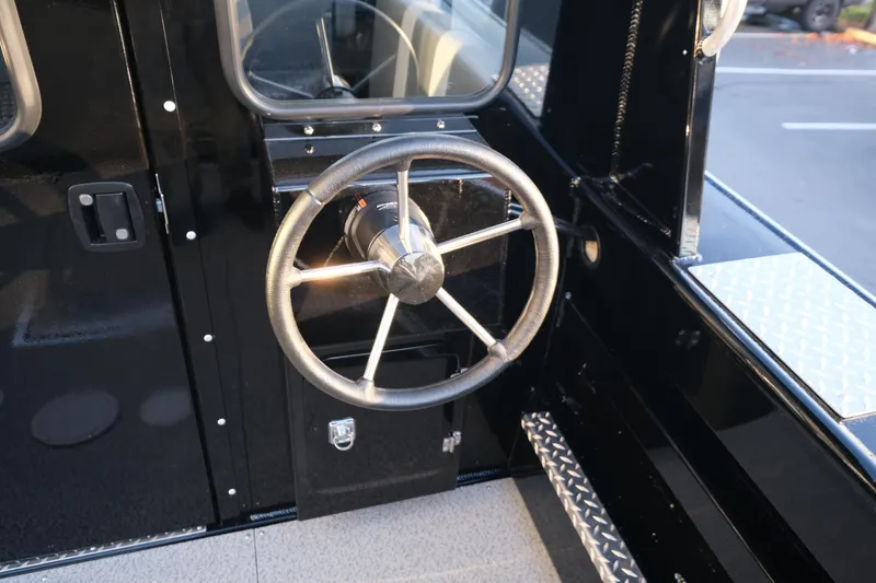 Slide: The Image of 2025 Hewescraft 220 Ocean Pro ET HT steering wheel and dashboard detail. - 20