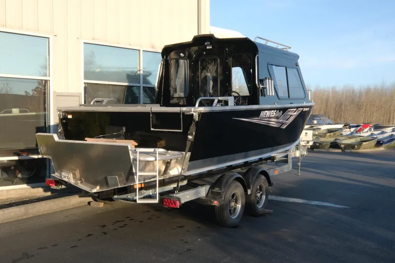 Slide: The Image of 2025 Hewescraft 220 Ocean Pro ET HT boat on trailer, parked outdoors. - 4