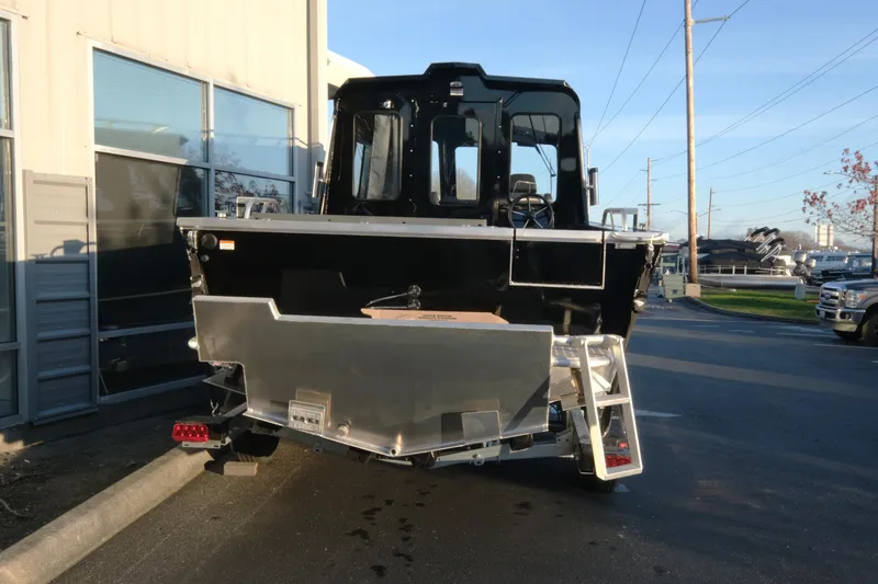 Slide: The Image of 2025 Hewescraft 220 Ocean Pro ET HT boat, rear view, parked outdoors. - 5