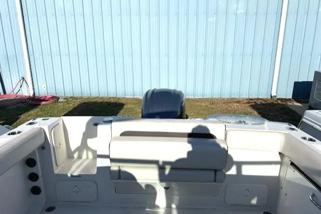 Slide: The Image of 2021 Sailfish 245 DC boat interior with seating and engine view. - 8