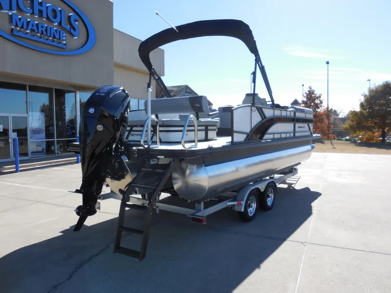 Slide: The Image of 2025 Bennington 23 SSB pontoon boat on trailer at Nichols Marine dealership. - 3