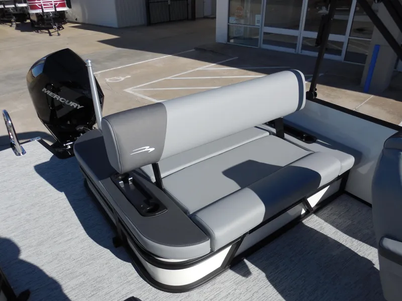 Slide: The Image of 2025 Bennington 23 SSB boat with gray seating and Mercury outboard motor. - 8