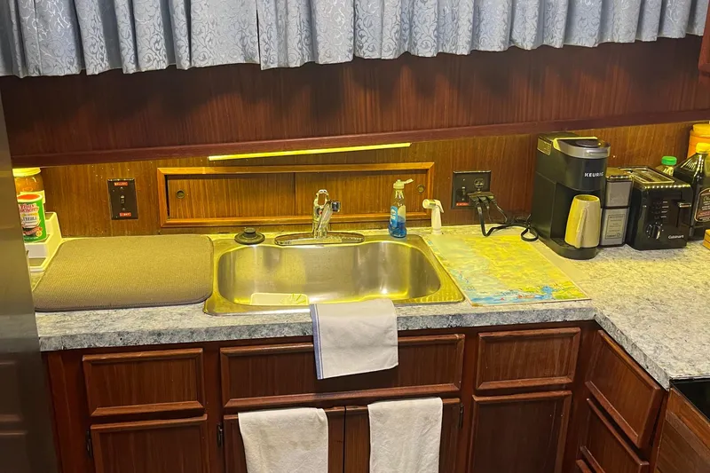 Slide: The Image of Kitchen area of 1984 Hatteras 53 Motor Yacht with sink and appliances. - 20