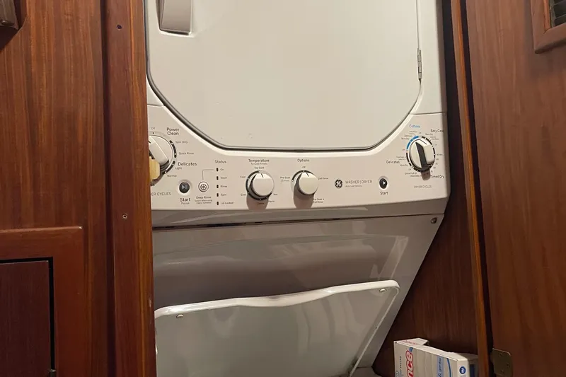 Slide: The Image of Laundry area with stacked washer-dryer in 1984 Hatteras 53 Motor Yacht. - 22