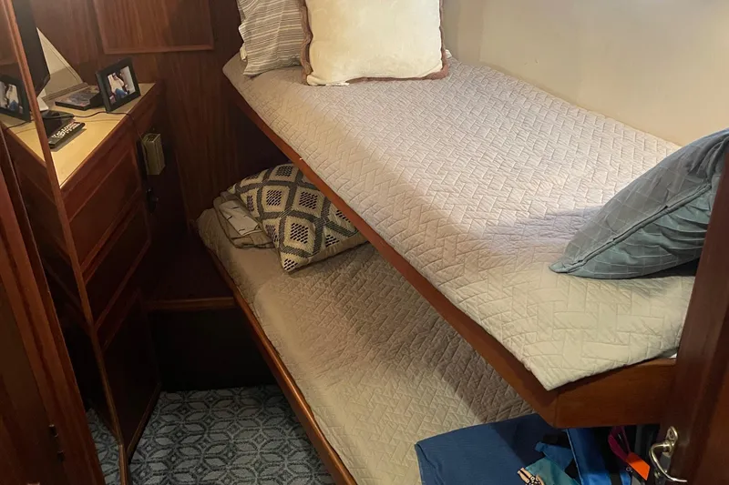 Slide: The Image of Cozy cabin with bunk beds in 1984 Hatteras 53 Motor Yacht. - 24