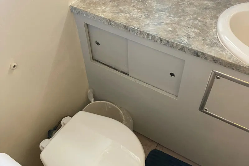 Slide: The Image of Bathroom interior of 1984 Hatteras 53 Motor Yacht with toilet and sink. - 27