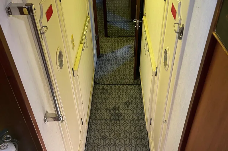 Slide: The Image of Interior hallway of 1984 Hatteras 53 Extended Deckhouse Motor Yacht with patterned carpet. - 29