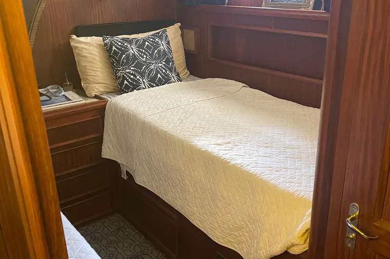 Slide: The Image of Cozy cabin interior of 1984 Hatteras 53 Motor Yacht with single bed and wooden furnishings. - 30