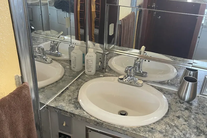 Slide: The Image of Bathroom sink area on 1984 Hatteras 53 Extended Deckhouse Motor Yacht, featuring granite countertop. - 34