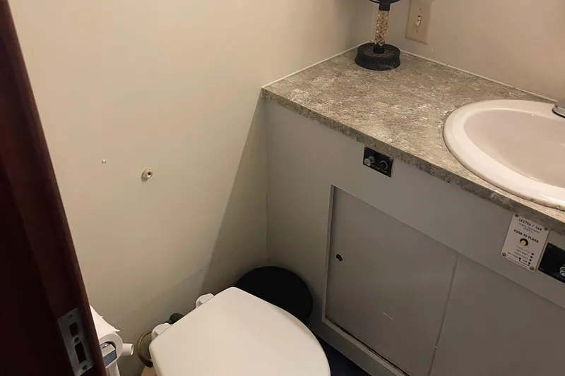 Slide: The Image of Bathroom interior of 1984 Hatteras 53 Motor Yacht with sink and toilet. - 42