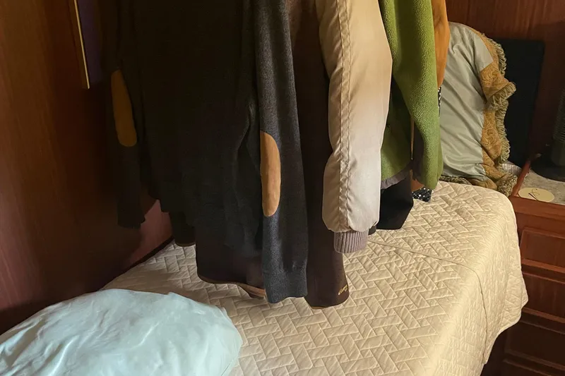 Slide: The Image of Clothes hanging in a cabin of a 1984 Hatteras 53 Motor Yacht. - 44