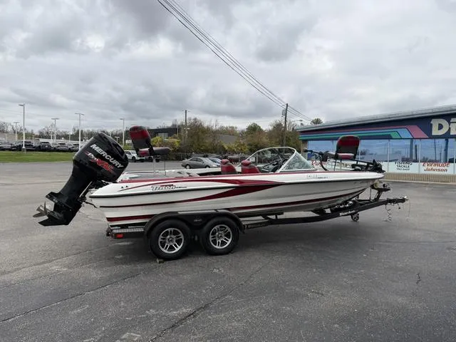 Slide: The Image of 2014 Triton 220 Escape boat with Mercury outboard motor on trailer. - 6