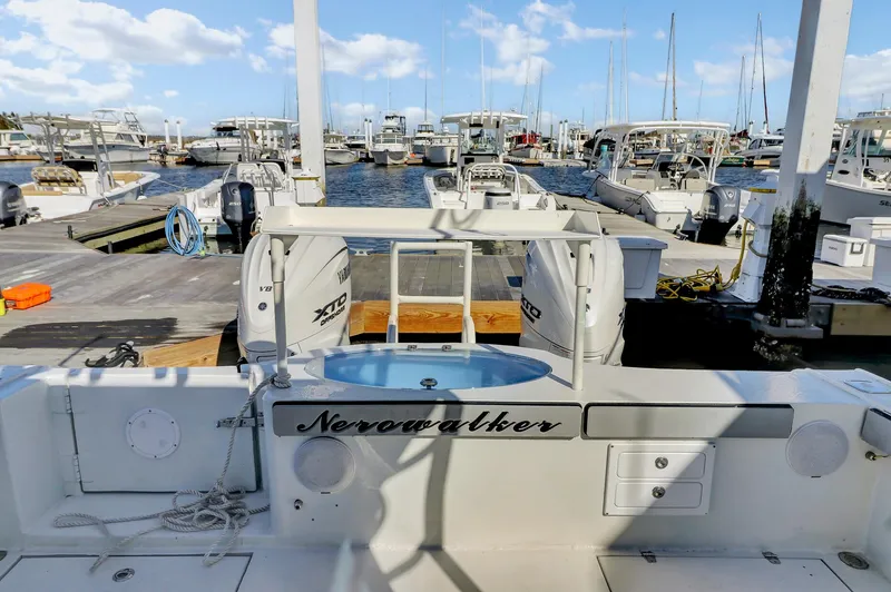 Slide: The Image of Custom 2024 Nerowalker boat docked at marina with clear blue sky. - 10