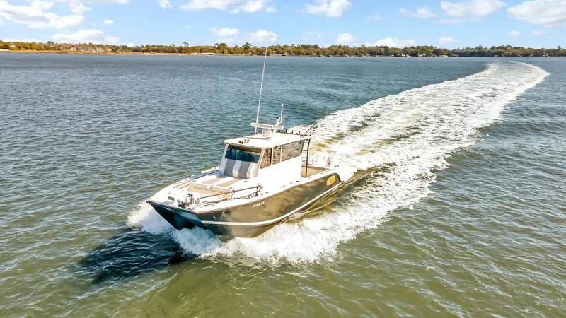 Slide: The Image of Custom Nerowalker 2024 boat cruising on a sunny day, leaving a wake behind. - 3