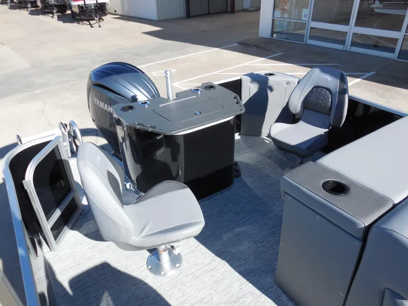 Slide: The Image of 2025 Bennington 23 SS boat interior with Yamaha engine and gray seating. - 8