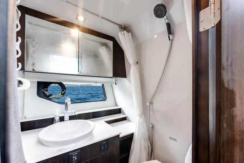 Slide: The Image of Luxurious bathroom interior of 2023 Cruisers Yachts 42 GLS OB with ocean view. - 13