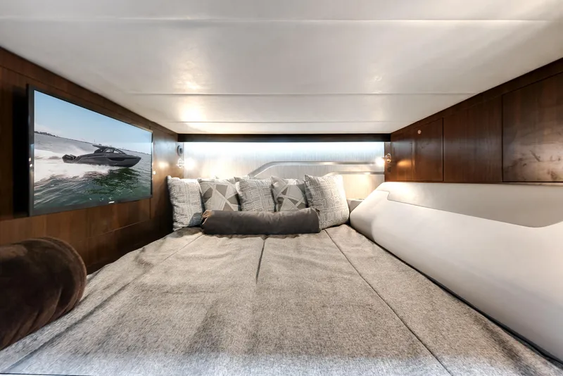 Slide: The Image of Luxurious cabin interior of 2023 Cruisers Yachts 42 GLS OB with cozy bedding and modern decor. - 15
