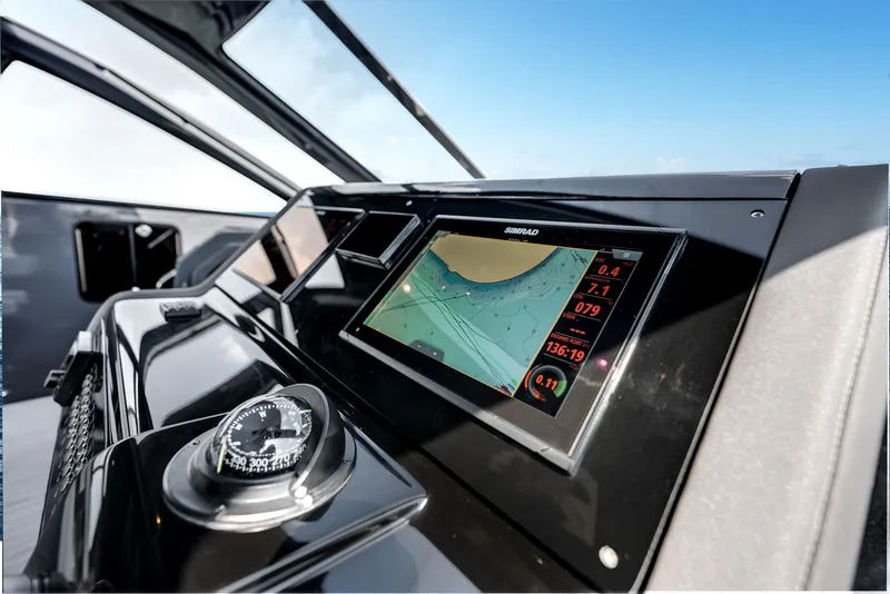 Slide: The Image of 2023 Cruisers Yachts 42 GLS OB dashboard with navigation display and compass. - 32