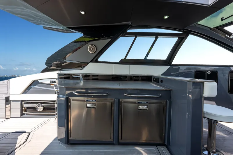 Slide: The Image of 2023 Cruisers Yachts 42 GLS OB interior with modern kitchen and sleek design. - 38
